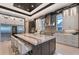 Gourmet kitchen with a marble island, stainless steel appliances, and sleek cabinetry at 14733 Como Cir, Lakewood Ranch, FL 34202