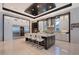 Modern kitchen featuring stainless steel appliances, a large island with seating, and stylish cabinetry at 14733 Como Cir, Lakewood Ranch, FL 34202