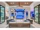 Stunning living room with water views and modern coastal decor, perfect for relaxing and entertaining at 14733 Como Cir, Lakewood Ranch, FL 34202