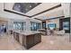 Open-concept living area featuring modern kitchen, comfortable seating, and stunning views at 14733 Como Cir, Lakewood Ranch, FL 34202