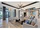 Spacious living room showcasing high ceilings, modern lighting, a comfortable sectional sofa, and elegant decor at 14733 Como Cir, Lakewood Ranch, FL 34202