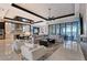 Bright, open living room with floor to ceiling windows and sleek modern design at 14733 Como Cir, Lakewood Ranch, FL 34202