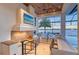 Outdoor kitchen area with high-end grill and breathtaking waterfront views, perfect for entertaining at 14733 Como Cir, Lakewood Ranch, FL 34202