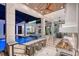 Luxurious outdoor kitchen and bar overlooking the pool, perfect for entertaining and dining al fresco at 14733 Como Cir, Lakewood Ranch, FL 34202