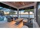 Beautiful outdoor area with seating and fire pit, surrounded by lush landscaping and scenic water views at 14733 Como Cir, Lakewood Ranch, FL 34202