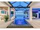 Beautiful pool and spa with sleek glass roof and open layout overlooking the waterfront at 14733 Como Cir, Lakewood Ranch, FL 34202