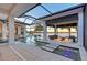 Serene outdoor living area featuring a pool, spa, and covered patio with waterfront views at 14733 Como Cir, Lakewood Ranch, FL 34202