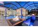 Sparkling pool with fire feature, offering a luxurious and relaxing outdoor living space at 14733 Como Cir, Lakewood Ranch, FL 34202