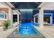 Luxurious pool with waterfall feature and integrated spa for a relaxing outdoor experience at 14733 Como Cir, Lakewood Ranch, FL 34202