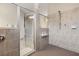 Modern bathroom with tiled shower, glass door and neutral color palette at 15607 White Linen Dr, Lakewood Ranch, FL 34211