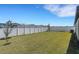 Spacious backyard featuring a well-maintained lawn and privacy fence at 1901 Everson St, Bradenton, FL 34208