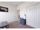 Neutral-toned bedroom with carpet flooring, white walls, closet, and paneled door at 1901 Everson St, Bradenton, FL 34208