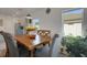Well lit dining room with views to the outside and the kitchen at 1901 Everson St, Bradenton, FL 34208