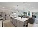 Modern kitchen with stainless steel appliances that opens to living and dining areas at 1901 Everson St, Bradenton, FL 34208