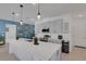 Modern kitchen with island, stainless steel appliances, and pendant lighting at 1901 Everson St, Bradenton, FL 34208