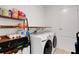 Well-organized laundry room with shelving and modern washer and dryer at 1901 Everson St, Bradenton, FL 34208