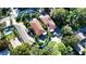 Stunning aerial view of two adjacent homes each featuring private pools and lush tropical landscaping for ultimate privacy at 2047 Roselawn St, Sarasota, FL 34231