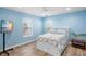 Bedroom featuring a bed, ceiling fan, and bright windows at 264 S Harbor Dr, Holmes Beach, FL 34217