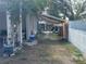 Backyard of a single Gathering home with a white picket fence and mature tree at 3305 13Th W Ave, Bradenton, FL 34205