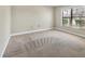 Bedroom with neutral carpet, ample sunlight from the window, and a clean, simple design at 3629 Longmeadow # 38, Sarasota, FL 34235