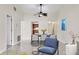 Dining room featuring a ceiling fan, tile floors, and a modern table set with six chairs at 3629 Longmeadow # 38, Sarasota, FL 34235