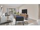 Stylishly furnished living room with sliding glass doors to the lanai, promoting seamless indoor/outdoor living at 3629 Longmeadow # 38, Sarasota, FL 34235
