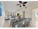 Open-concept dining and living space featuring neutral paint, tile floors, and plenty of natural light at 3629 Longmeadow # 38, Sarasota, FL 34235