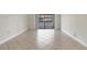 Bright living room boasting tile floors and sliding glass doors for plenty of natural light at 3629 Longmeadow # 38, Sarasota, FL 34235