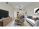 Bright, furnished living area with ample seating and views into the dining area at 3629 Longmeadow # 38, Sarasota, FL 34235