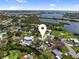 Aerial view of waterfront homes with Gulf access and lush landscaping in a beautiful coastal community at 400 Dona Dr, Nokomis, FL 34275