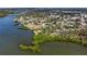 Stunning aerial view of waterfront homes and lush landscape along the river canal at 400 Dona Dr, Nokomis, FL 34275