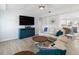 Inviting living room features wood floors, cozy furniture, and an open layout with eat-in kitchen at 400 Dona Dr, Nokomis, FL 34275