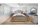 Comfortable main bedroom featuring a ceiling fan, light-colored walls, and tasteful decor at 400 Dona Dr, Nokomis, FL 34275