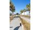Street lined with palm trees providing a peaceful neighborhood ambiance at 400 Dona Dr, Nokomis, FL 34275