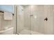 The bathroom features a walk-in shower with seamless glass and marble tile at 4207 Marina View Way, Cortez, FL 34215
