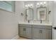 Elegant bathroom with double vanities, modern mirrors, and contemporary fixtures, providing a luxurious and functional space at 4207 Marina View Way, Cortez, FL 34215