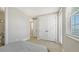 This light-filled bedroom has wood floors, double closets, and a tranquil feel at 4207 Marina View Way, Cortez, FL 34215