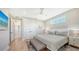 Comfortable bedroom with neutral decor, ample closet space, and wood floors, creating a serene and inviting atmosphere at 4207 Marina View Way, Cortez, FL 34215