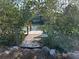 Private dock surrounded by lush greenery and waterway views at 4207 Marina View Way, Cortez, FL 34215