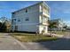 This is a three-story beach house with multi-level balconies and a ground-level garage at 4207 Marina View Way, Cortez, FL 34215