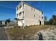Stunning three-story home with a two-car garage and multiple balconies at 4207 Marina View Way, Cortez, FL 34215