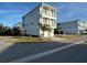 This is a multi-story home featuring a ground-level garage and multiple balconies at 4207 Marina View Way, Cortez, FL 34215