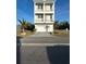 This is a three-story house with a ground-level garage and multiple balconies at 4207 Marina View Way, Cortez, FL 34215