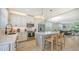 Open kitchen featuring stainless steel appliances, marble counters, and adjacent dining area at 4207 Marina View Way, Cortez, FL 34215