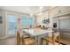 Modern kitchen featuring white cabinetry, stainless steel appliances, and an island at 4207 Marina View Way, Cortez, FL 34215