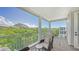 Relaxing lanai featuring comfortable seating and an open view of the lush greenery and neighborhood landscape at 4207 Marina View Way, Cortez, FL 34215