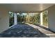 Covered outdoor patio with a view of lush greenery, perfect for relaxing outdoors at 4207 Marina View Way, Cortez, FL 34215