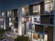 Modern condominium at night with views from the private balconies at 430 Kumquat Ct # 206, Sarasota, FL 34236