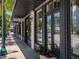Storefront of 'Kitchens & More' featuring large windows, a sidewalk display, and classic architectural details at 430 Kumquat Ct # 206, Sarasota, FL 34236
