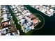 Beautiful aerial view of a waterfront home with a private pool and boat dock on a canal at 542 67Th St, Holmes Beach, FL 34217
